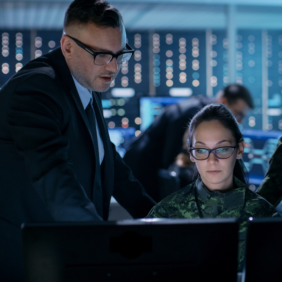 Government Surveillance Agency and Military Joint Operation. Male Agent, Female and Male Military Officers Working at System Control Center.